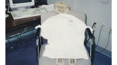 Quest Technology Group software developer cardboard character in his chair